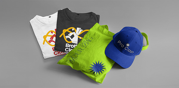 a group of t-shirts and a cap